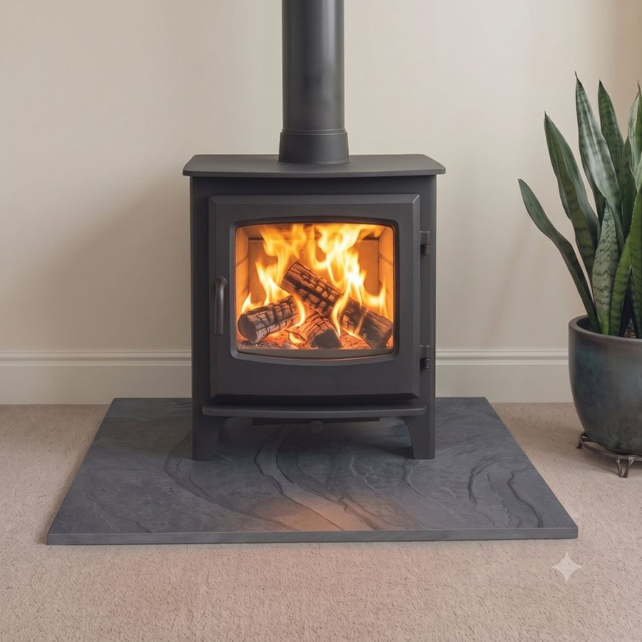 Brazilian black brushed slate hearth, 1200x900x20mm, calibrated for standard installations. Low-sheen matte aesthetic (aged feel) with tactile quality and dressed edges. Dispatched from Milton Keynes for UK delivery.