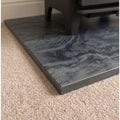 Close up edge detail of a precision cut honed Brazilian black slate hearth slab