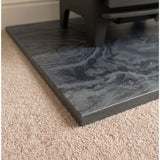Close-up of the chamfered edge detail on a honed Brazilian black slate hearth slab