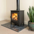 Brazilian black honed slate fireplace hearth slab with natural matte stone finish. Angled left