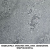 Close-up of the honed surface showing natural mineral movement in Brazilian black slate