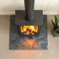 Top view of a honed Brazilian black slate stove hearth showing natural stone texture