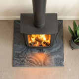 Top-down view of a honed Brazilian black slate hearth showing even tone across the full face