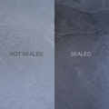 Comparison showing unsealed vs sealed black slate hearth slab finish options