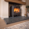 30mm thick black slate hearth slab with chamfered edge fitted under active log burner