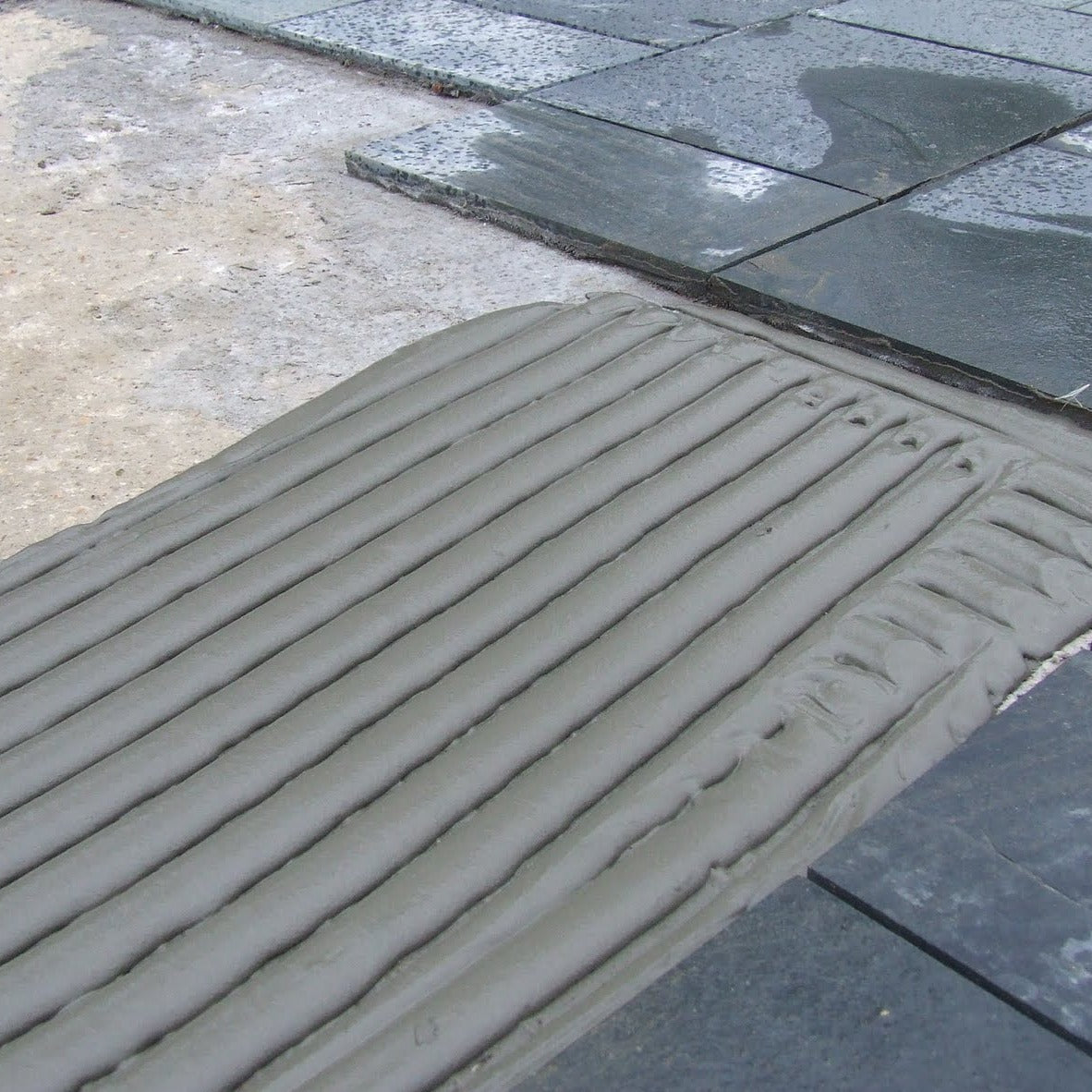 Black Slate Paving Tiles - adhesive used to fix tiles to base 